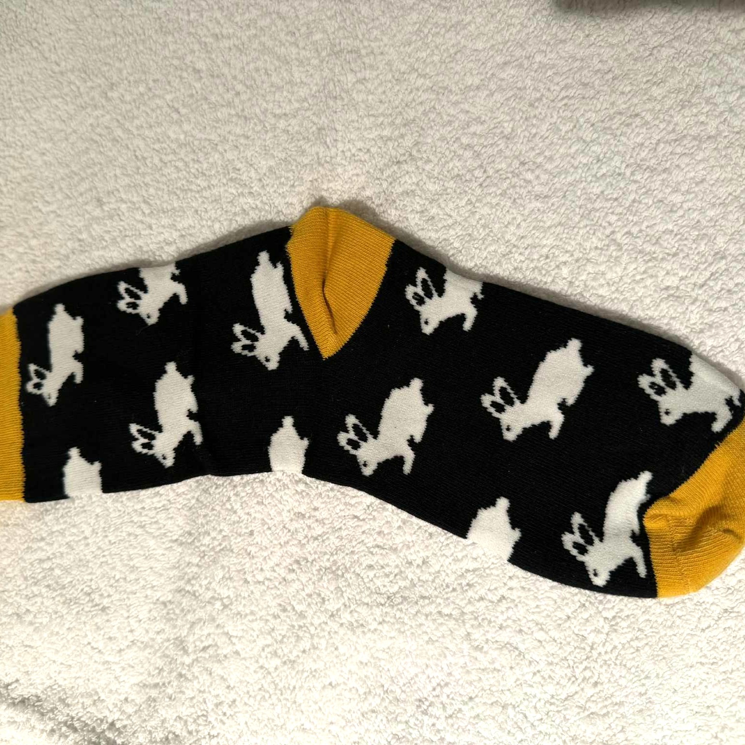 Sokk med mange hvite kaniner